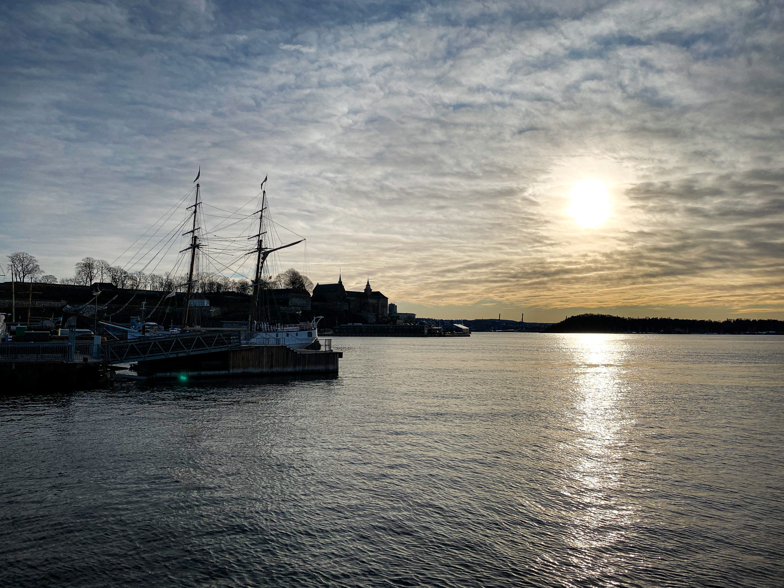 View from the Akershus Fortress in Oslo on the sun and boats