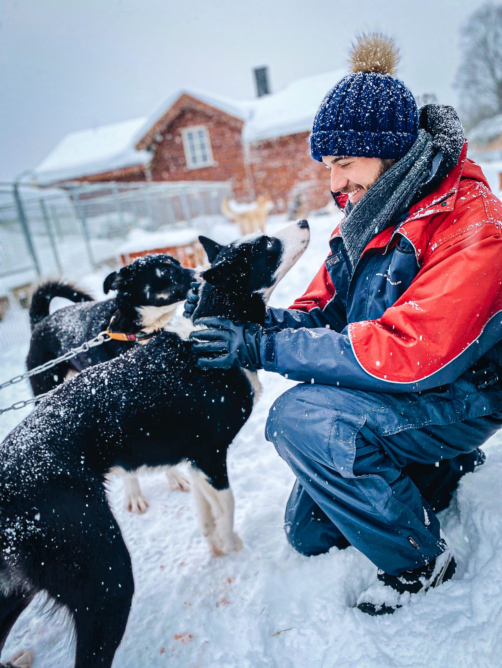 Man hugging a husky in Tromsø