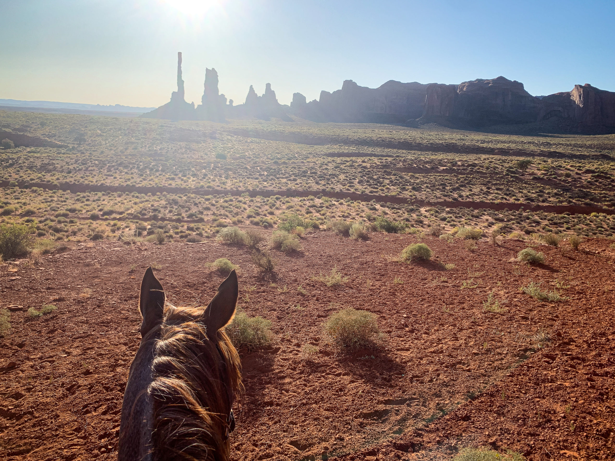 Horseback riding in Monument Valley at sunrise