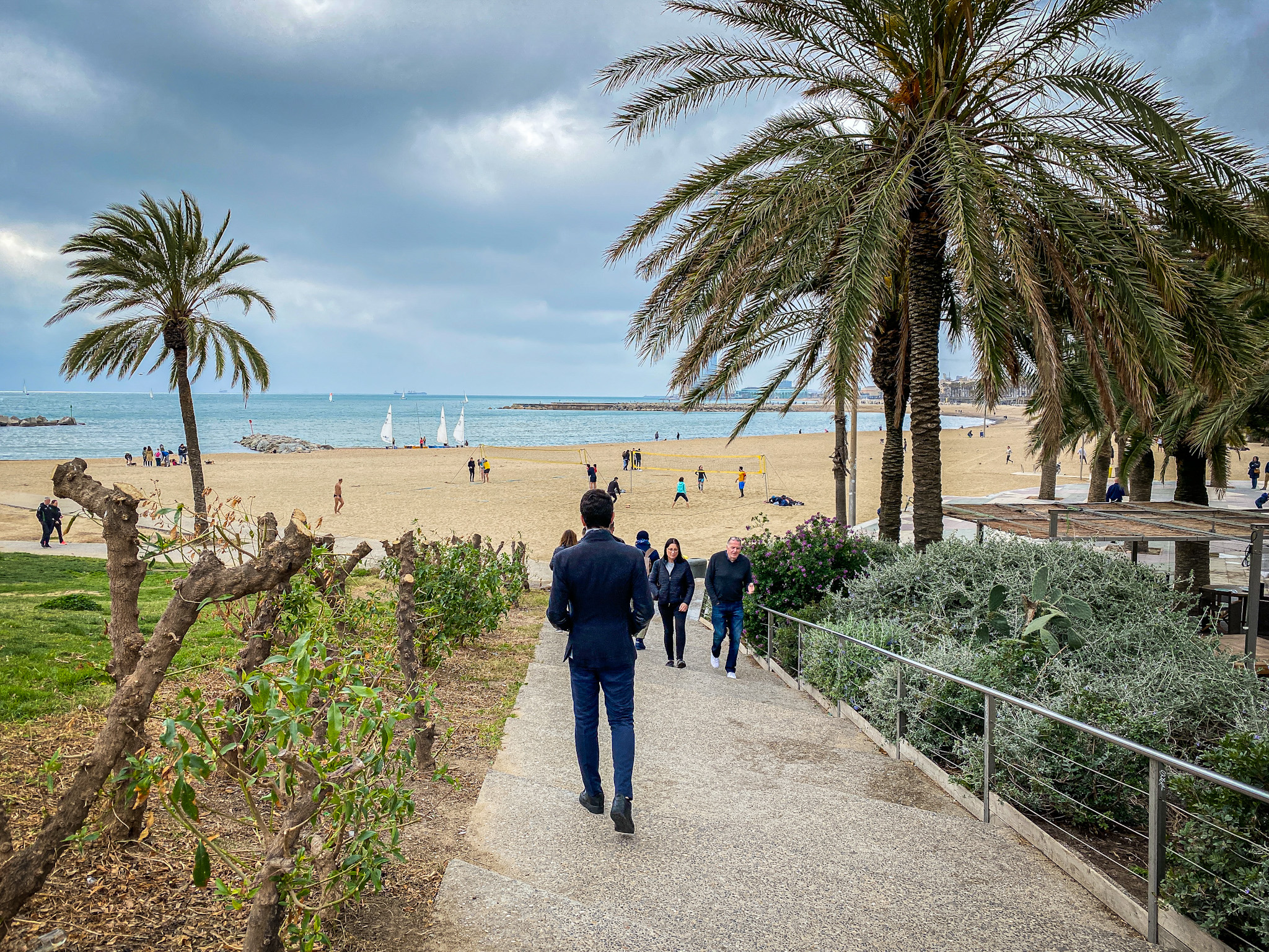 Man walking towards the beach in Barcelona