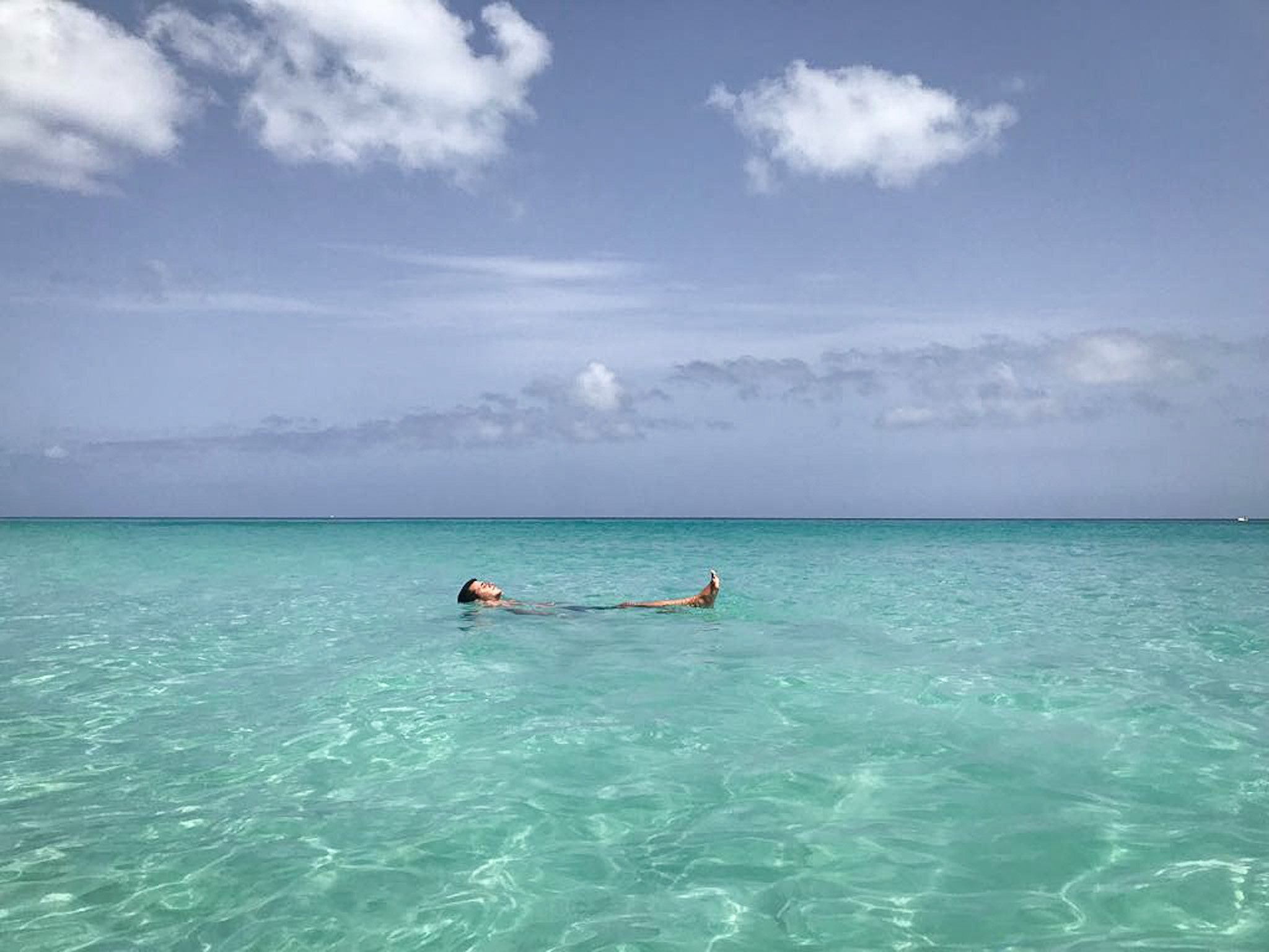 Man lying on the water in Varadero in Cuba