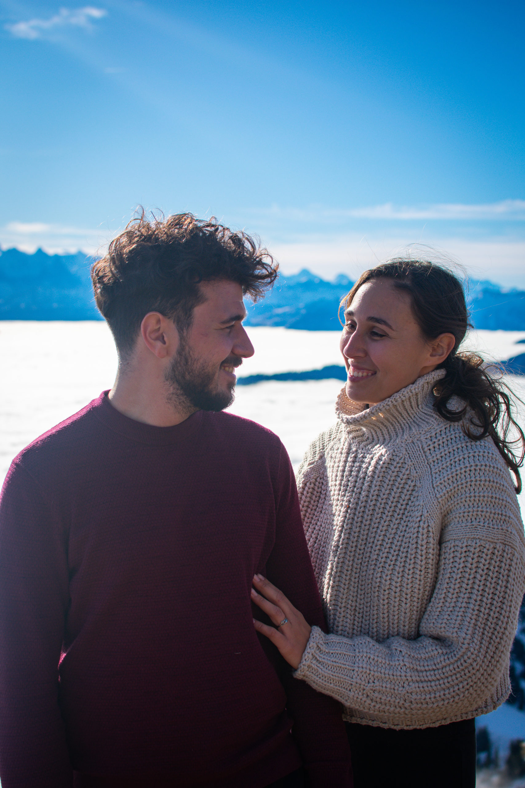 Couple looking at each other at the pilatus near Lucerne with a cloudy backgrounds